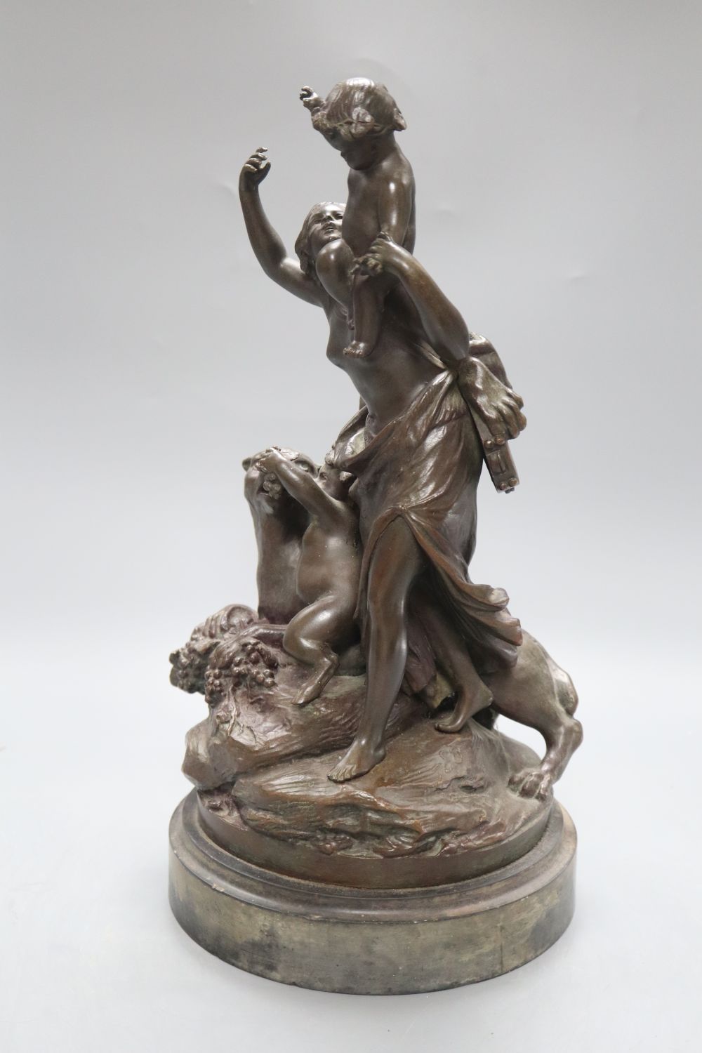 After Clodion. A bronze group of a mother, three putti and a panther, on naturalistic base and slate plinth, height 37.5cm